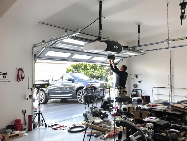 Paramount Garage Door Repair specialist installing smart garage door opener system in Paramount home
