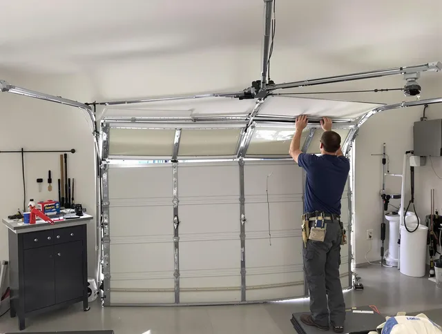 Paramount Garage Door Repair specialist performing precise section replacement on Paramount garage door