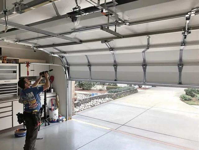 Garage door track repair service by Paramount Garage Door Repair in Paramount
